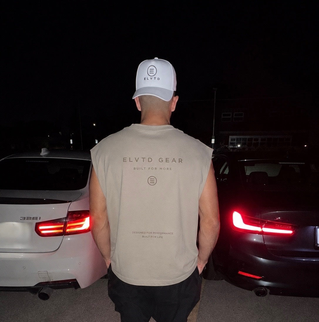 tan cutoff back print between cars at night