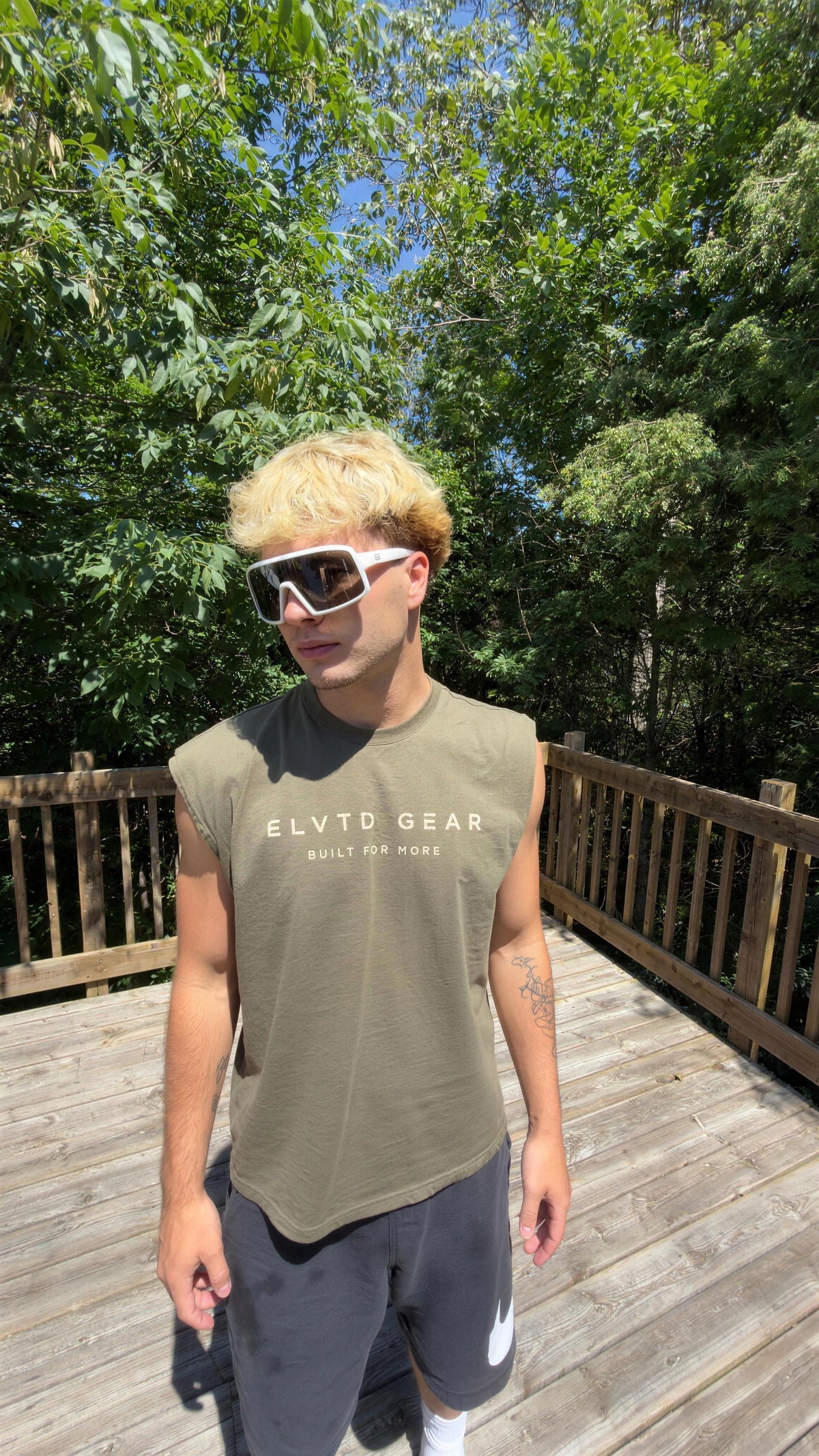 olive cutoff tee on deck (enhanced)